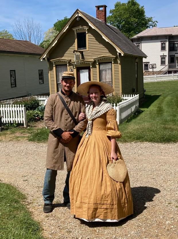 Second Corporal Levi Kinstle poses for a photo with seamstress Ryann Corbett at the 2023 Century Village Museum Civil War Encampment on May 27. Kinstle, of Millersburg, is portraying a Confederate soldier, while Corbett, of Akron, is re-enacting as a civilian supporter of the Confederate Army. The encampment concludes on May 28 with activities from 10 a.m. to 5 p.m. at Century Village Museum, located at 14653 E. Park St. in Burton Village. (Bill DeBus - The News-Herald)